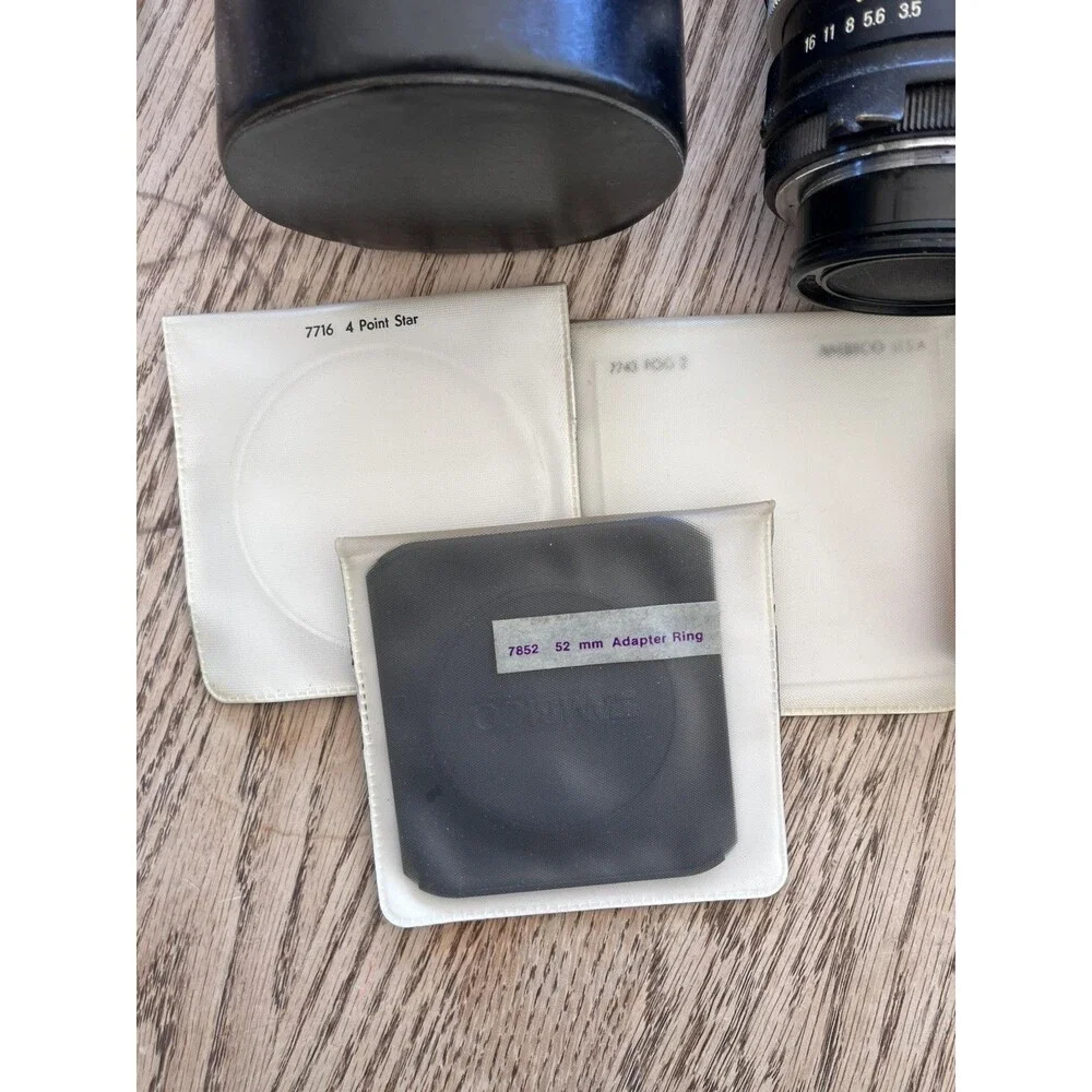 Nikon Nikkormat FTN 35 mm Camera with Additional lens, leather cases, & extras
